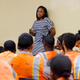 Rodney King’s daughter Lora King, 32, speaks to a group of young people who have had their own run-ins with police at a meeting of the Los Angeles Conservation Corps, which provides at-risk youth with job training, education and work, in downtown Los Angeles Thursday, Sept. 15, 2016.